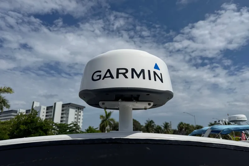 Slide: The Image of Garmin radar on 2017 Four Winns H290 boat under a partly cloudy sky. - 26