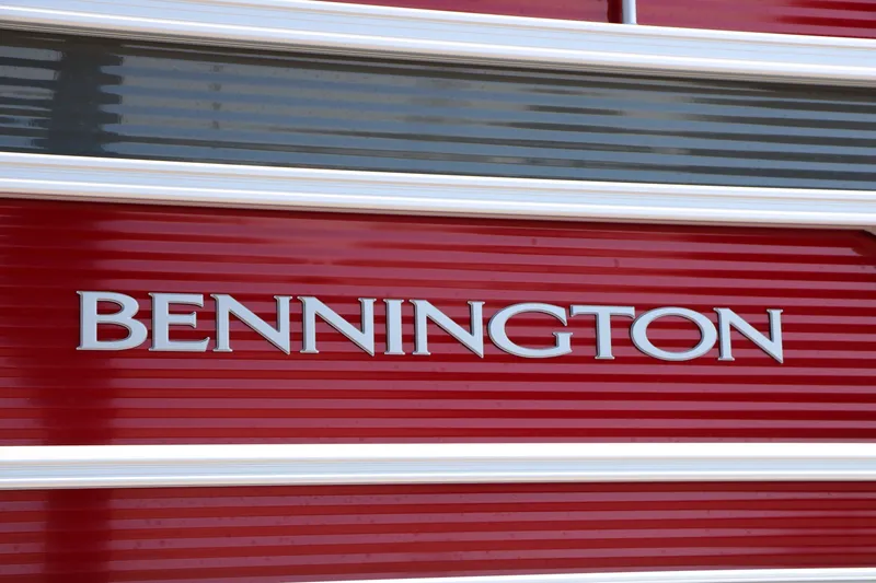 Slide: The Image of 2026 Bennington 22 SSR Tri-Toon boat, red exterior with logo detail. - 9