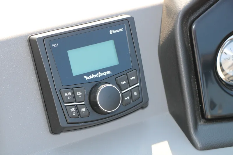 Slide: The Image of Rockford Fosgate PMX-1 Bluetooth stereo on 2026 Bennington 22 SSR Tri-Toon boat dashboard. - 28