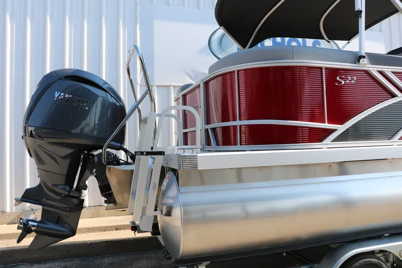 Slide: The Image of 2026 Bennington 22 SSR Tri-Toon boat with Yamaha outboard motor, red and silver design. - 14