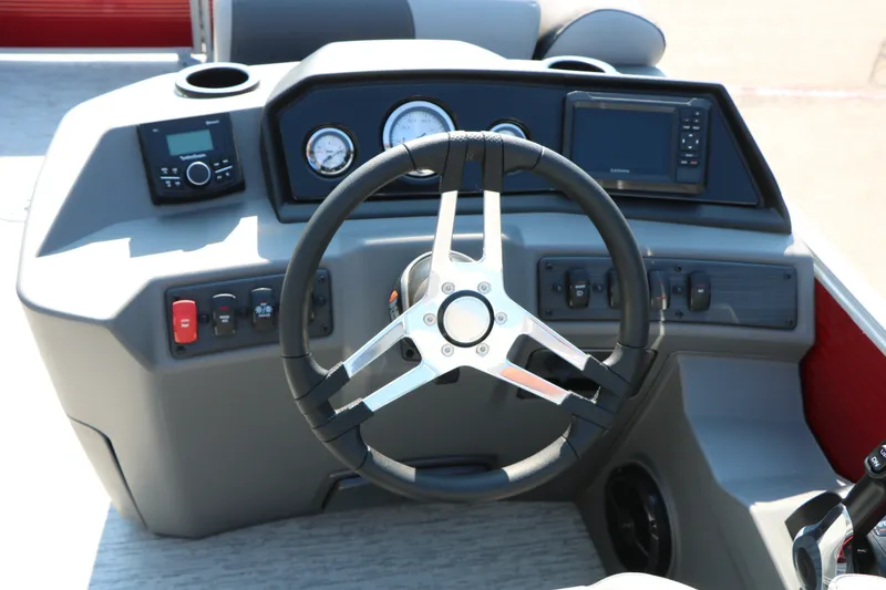 Slide: The Image of Steering console of 2026 Bennington 22 SSR Tri-Toon with modern controls and gauges. - 27