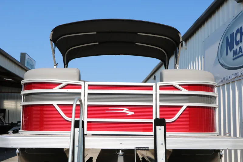 Slide: The Image of 2026 Bennington 22 SSR Tri-Toon pontoon boat with red exterior and black canopy. - 5