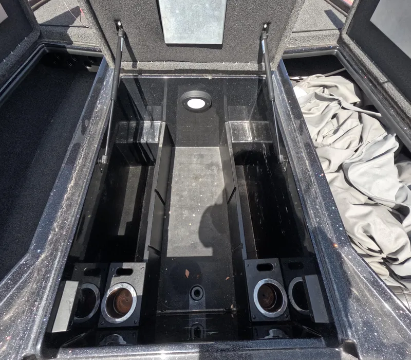 Slide: The Image of Open storage compartment in a 2019 Nitro Z19 boat, showing interior details. - 12