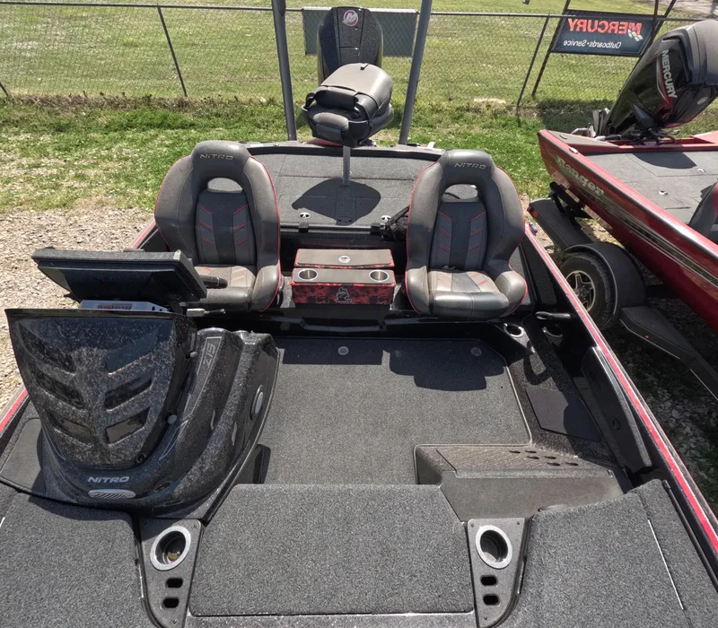 Slide: The Image of 2019 Nitro Z19 boat interior with dual seats and fishing equipment. - 13