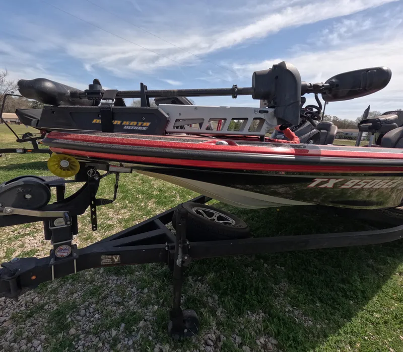 Slide: The Image of 2019 Nitro Z19 boat on trailer, parked on grass under a blue sky. - 6