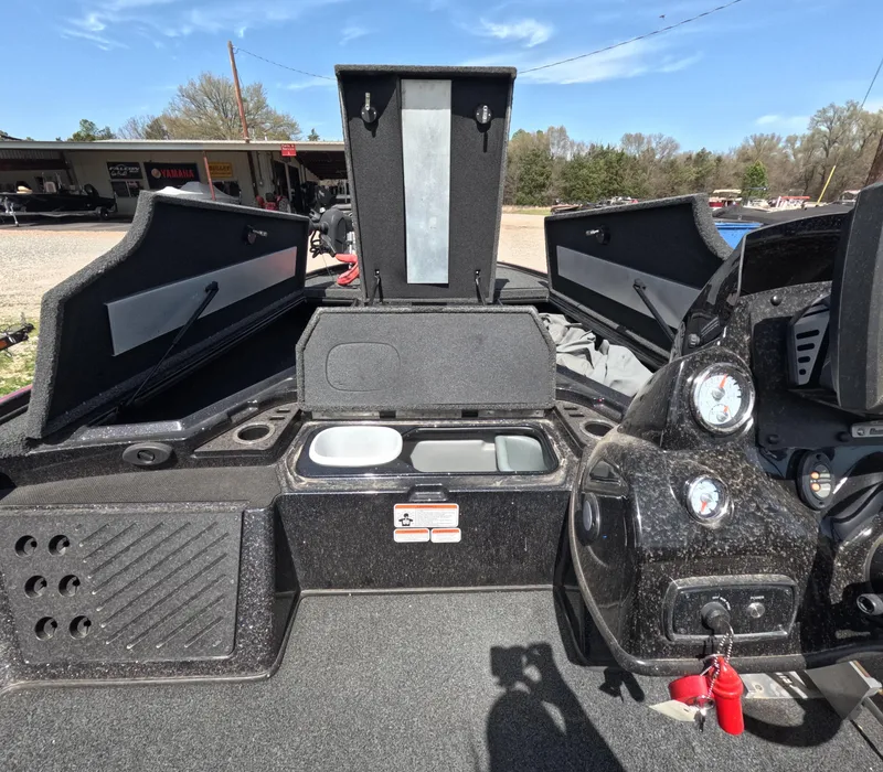 Slide: The Image of 2019 Nitro Z19 boat interior with open storage compartments and control panel. - 11