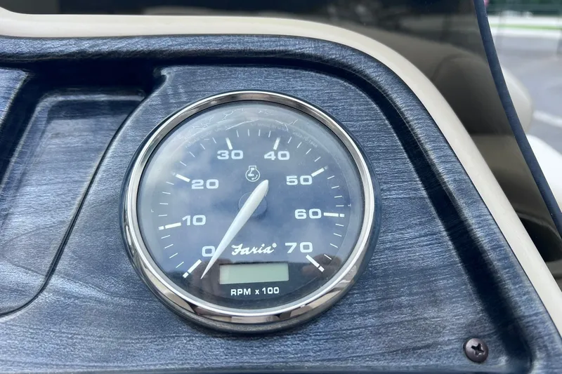 Slide: The Image of Tachometer on 2021 Godfrey Sweetwater 2086 C boat dashboard, displaying RPM. - 19