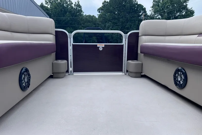 Slide: The Image of Interior view of 2021 Godfrey Sweetwater 2086 C pontoon boat with cushioned seating. - 26
