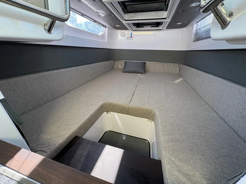 Slide: The Image of Interior of the 2024 Axopar 37 XC Cross Cabin with gray upholstery and skylights. - 13