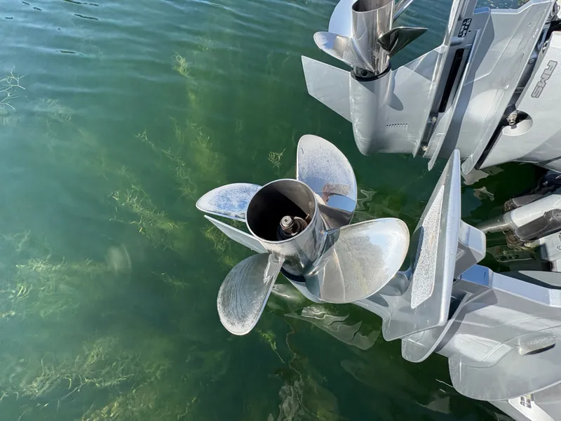 Slide: The Image of Close-up of a shiny propeller in the water, part of an Axopar 37 XC Cross Cabin boat. - 49