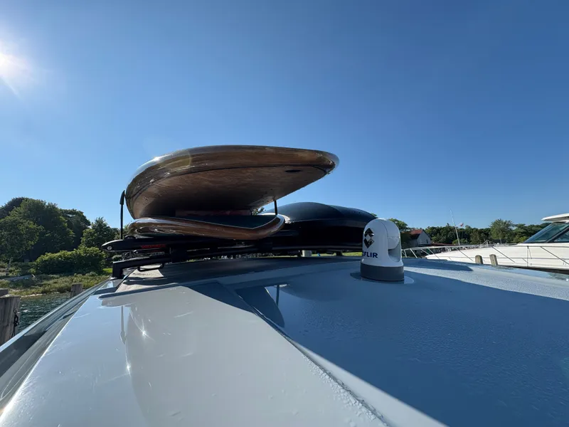 Slide: The Image of The image shows the roof of an Axopar 37 XC Cross Cabin with surfboards on top. - 41