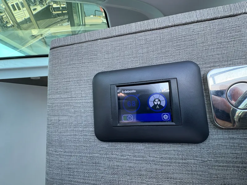 Slide: The Image of A modern control panel in a 2024 Axopar 37 XC Cross Cabin. - 35