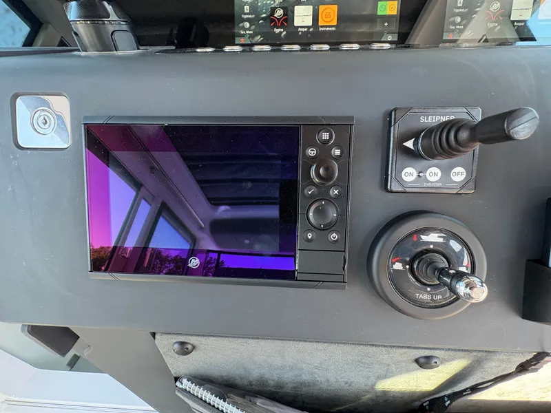 Slide: The Image of The image shows the dashboard of a 2024 Axopar 37 XC Cross Cabin with modern controls. - 20