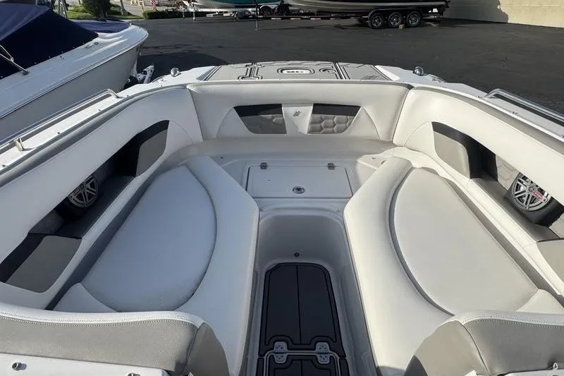 Slide: The Image of 2019 Four Winns HD240 Surf boat interior with spacious seating and sleek design. - 7
