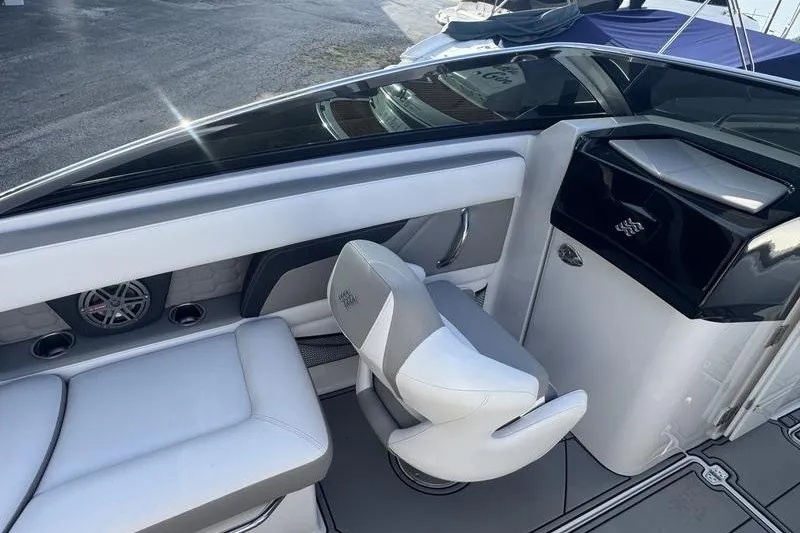 Slide: The Image of 2019 Four Winns HD240 Surf boat interior with sleek seating and modern design. - 5