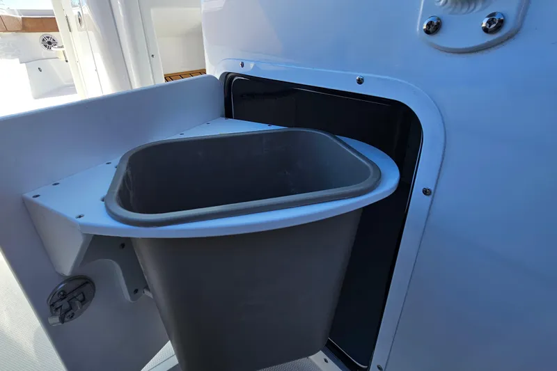 Slide: The Image of Built-in trash bin on 2026 Sea Hunt Ultra 275 Coffin Box boat. - 21