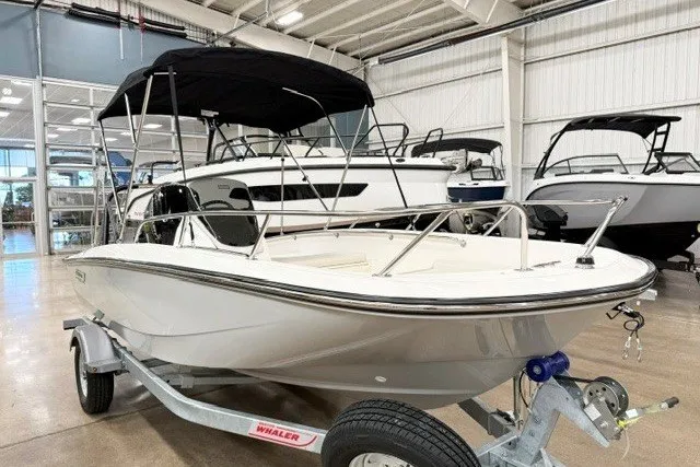 The Image of 2027 Boston Whaler 160 Super Sport boat on trailer in showroom. - 0