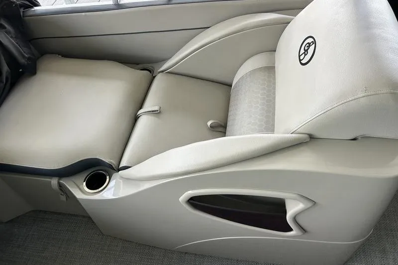 Slide: The Image of 2015 South Bay 524 SLTT boat seat with cup holder and armrest. - 14