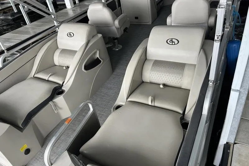 Slide: The Image of Luxurious seating on a 2015 South Bay 524 SLTT pontoon boat, featuring plush, comfortable design. - 13