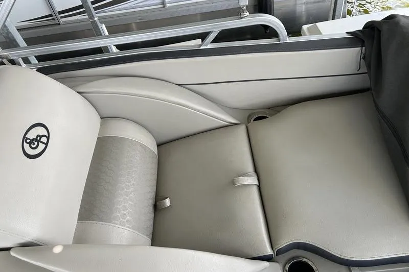 Slide: The Image of Luxurious seating on a 2015 South Bay 524 SLTT pontoon boat, featuring elegant upholstery. - 18