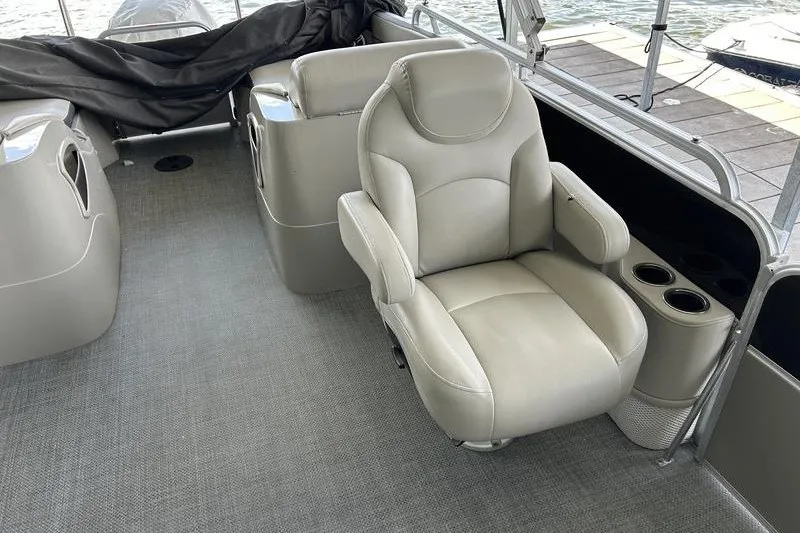 Slide: The Image of Luxurious seating on 2015 South Bay 524 SLTT pontoon boat with cup holders and armrests. - 20