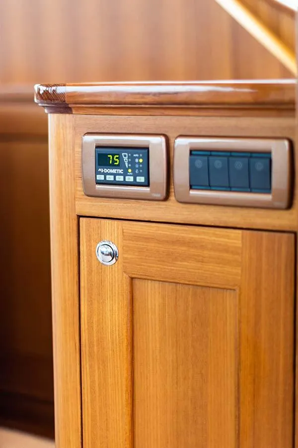 Slide: The Image of Wooden cabinet with built-in control panel and temperature display. - 21
