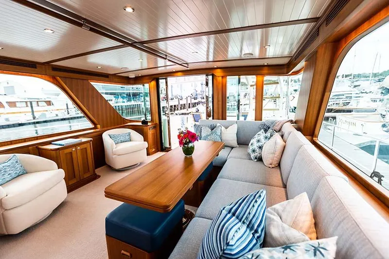 Slide: The Image of Interior of the Hunt Yachts Ocean 63 Flybridge with elegant seating area and large windows. - 31