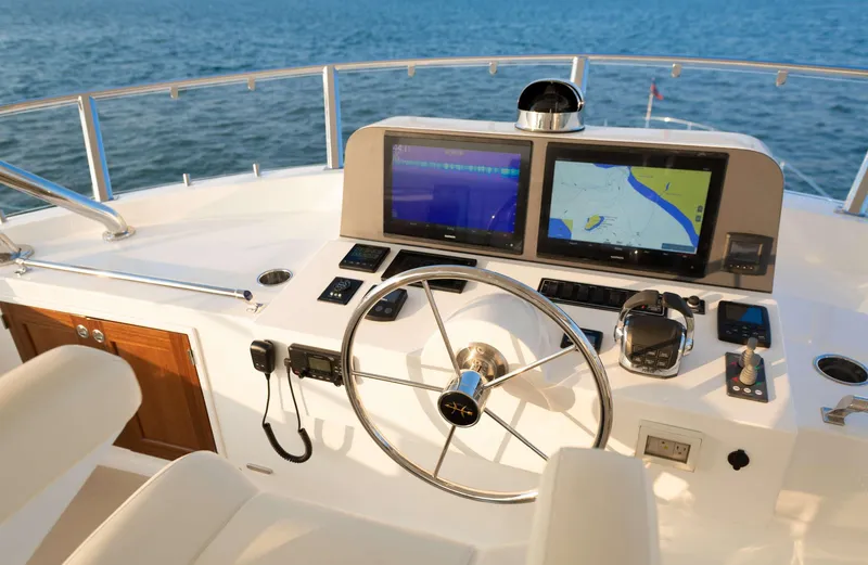 Slide: The Image of Flybridge helm of the 2020 Hunt Yachts Ocean 63 with modern navigation systems. - 10