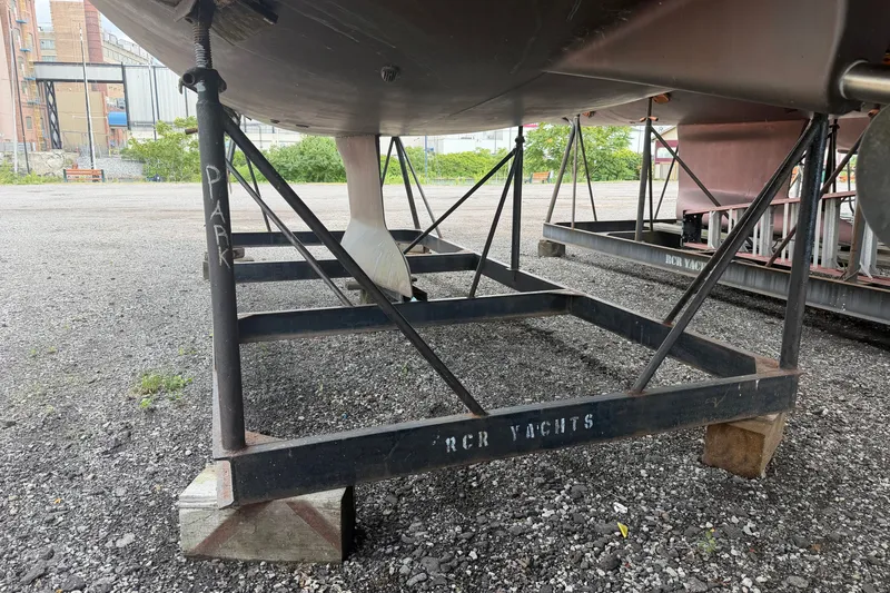 Slide: The Image of Beneteau Oceanis 31 (2009) yacht on metal cradle at RCR Yachts storage. - 54