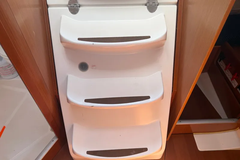 Slide: The Image of White interior steps on a 2009 Beneteau Oceanis 31 sailboat. - 49