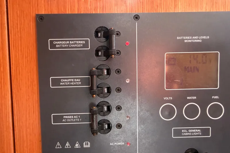 Slide: The Image of Electrical panel of a 2009 Beneteau Oceanis 31 sailboat, showing battery and power controls. - 41