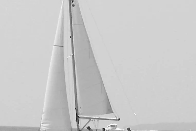 The Image of 2009 Beneteau Oceanis 31 sailboat with full sails on open water. - 3