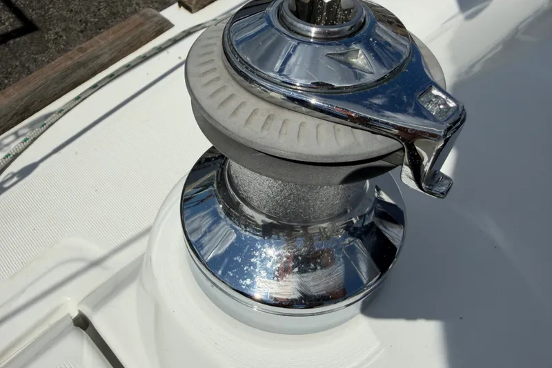 Slide: The Image of Chrome winch on 2009 Beneteau Oceanis 31 sailboat deck. - 52