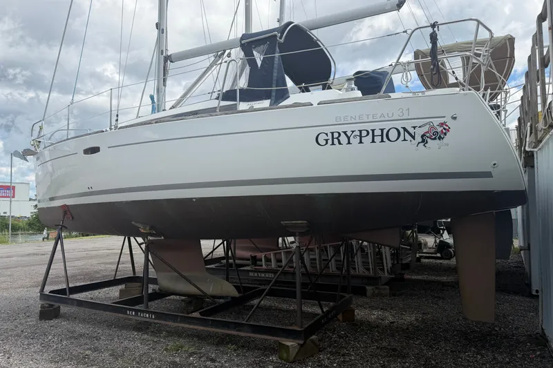 Slide: The Image of 2009 Beneteau Oceanis 31 sailboat named Gryphon on a storage cradle. - 2