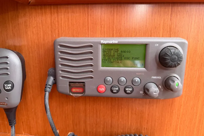 Slide: The Image of Raymarine VHF radio on 2009 Beneteau Oceanis 31 sailboat, featuring distress button and controls. - 39