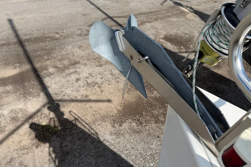 Slide: The Image of Anchor of a 2009 Beneteau Oceanis 31 sailboat on a gravel surface. - 57