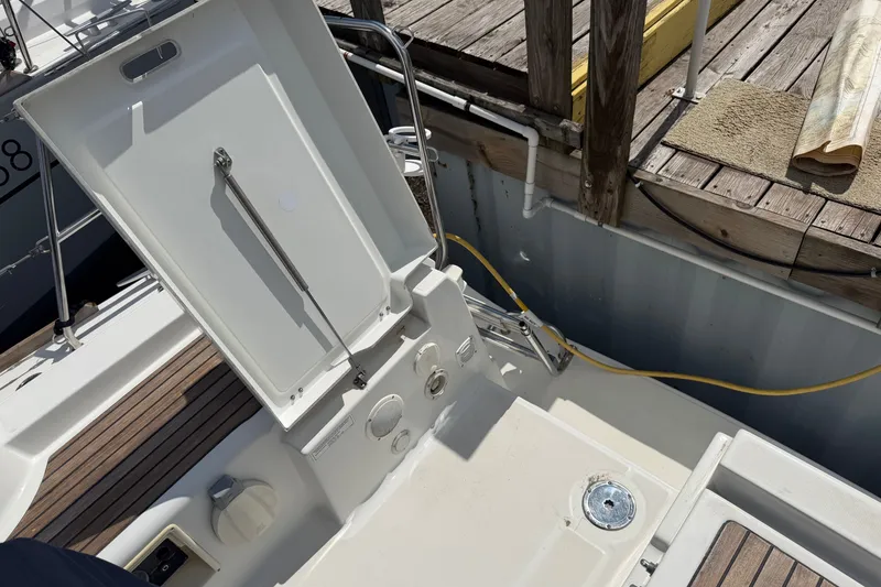 Slide: The Image of Open hatch on 2009 Beneteau Oceanis 31 sailboat docked at marina. - 10