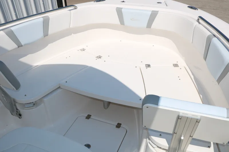 Slide: The Image of 2026 Robalo R230 Center Console boat interior with spacious seating and storage compartments. - 24