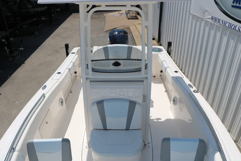 Slide: The Image of 2026 Robalo R230 Center Console boat with spacious seating and sleek design. - 19