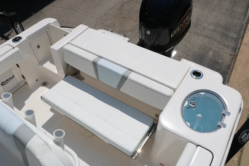 Slide: The Image of 2026 Robalo R230 Center Console boat interior with seating and livewell. - 28