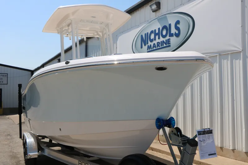 Slide: The Image of 2026 Robalo R230 Center Console boat at Nichols Marine dealership. - 6
