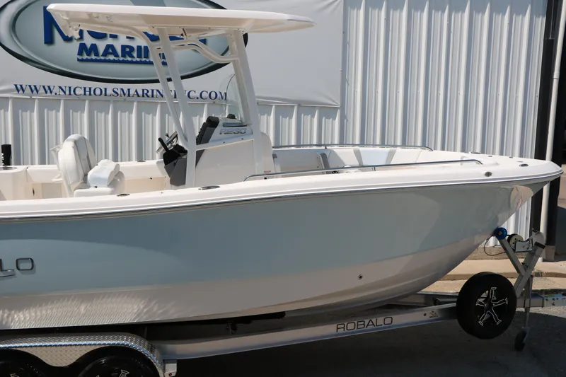 Slide: The Image of 2026 Robalo R230 Center Console boat on trailer at Nichols Marine. - 11