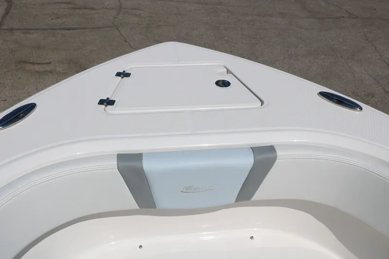 Slide: The Image of 2026 Robalo R230 Center Console boat bow with storage hatch and seating. - 39