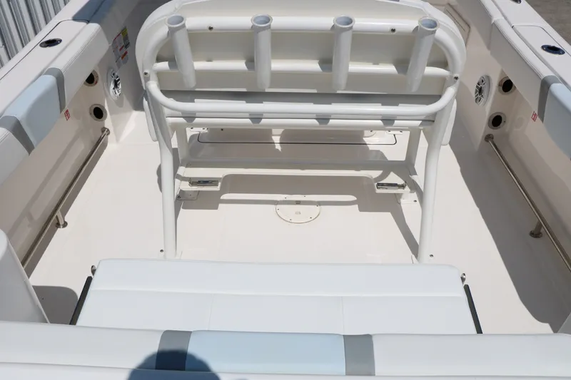 Slide: The Image of 2026 Robalo R230 Center Console boat interior with seating and rod holders. - 31