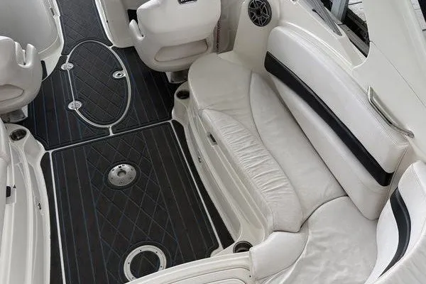 Slide: The Image of Luxurious interior of 2010 Larson LXi 288 boat with white seating and black flooring. - 15