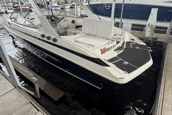 Slide: The Image of 2010 Larson LXi 288 boat docked in a marina, featuring sleek design and comfortable seating. - 17
