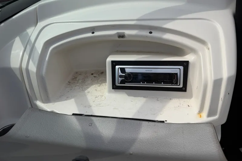 Slide: The Image of Boat dashboard with Kenwood stereo in a 2009 Monterey 234FS. - 16
