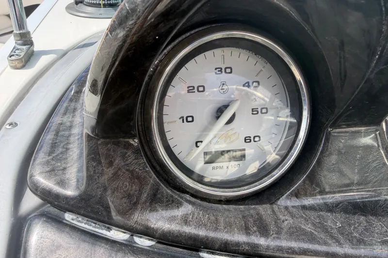Slide: The Image of Close-up of a 2009 Monterey 234FS boat tachometer displaying RPM readings. - 32