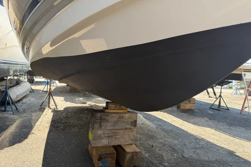 Slide: The Image of 2009 Monterey 234FS boat hull on wooden blocks in a dry dock. - 40