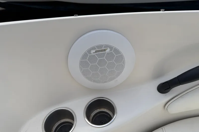 Slide: The Image of Bose speaker and cup holders on 2009 Monterey 234FS boat interior. - 26